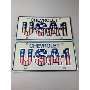 Vtg Chevrolet DEALER USA-1 License Plates Small Hole Embossed Metal Tag NOS Pair